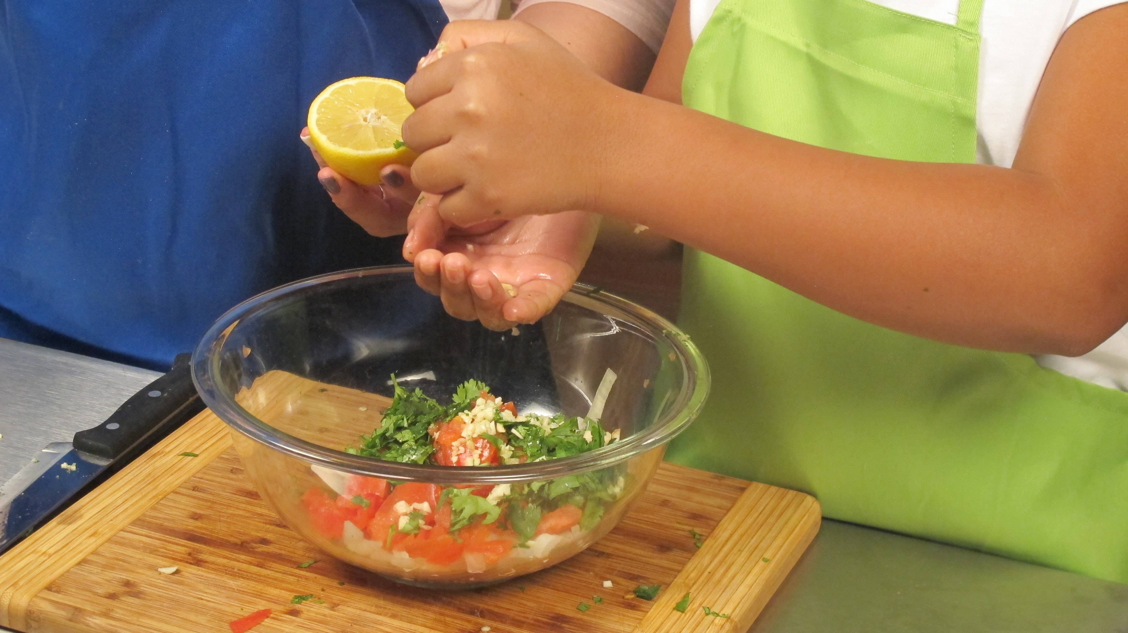 Add lemon, black pepper, garlic, salt, cilantro, and oil. Stir well.